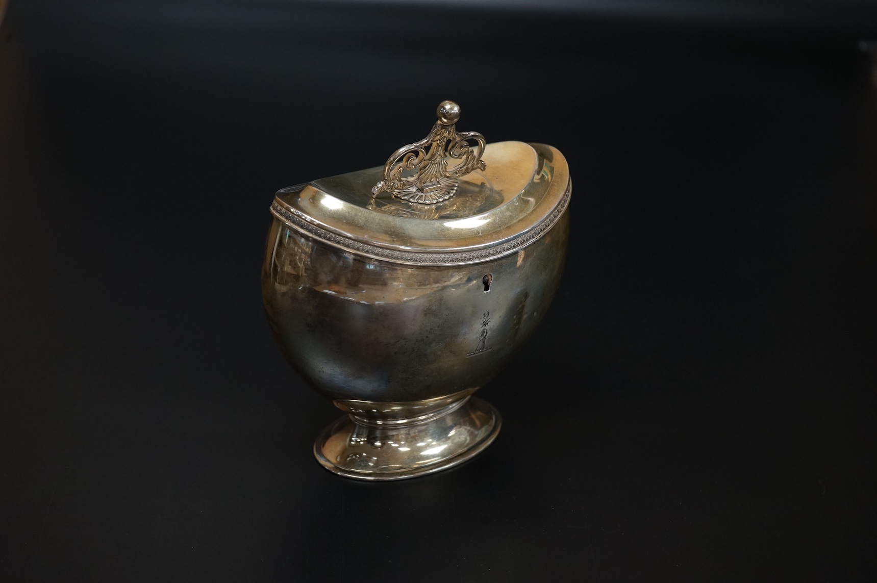 A late Victorian demi-fluted oval tea caddy, by William Hutton & Sons, London, 1894, width 11.1cm, together with a 19th century continental white metal oval tea caddy, possibly French, no key.